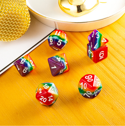 Set of colorful dice with numbers on a wooden surface.